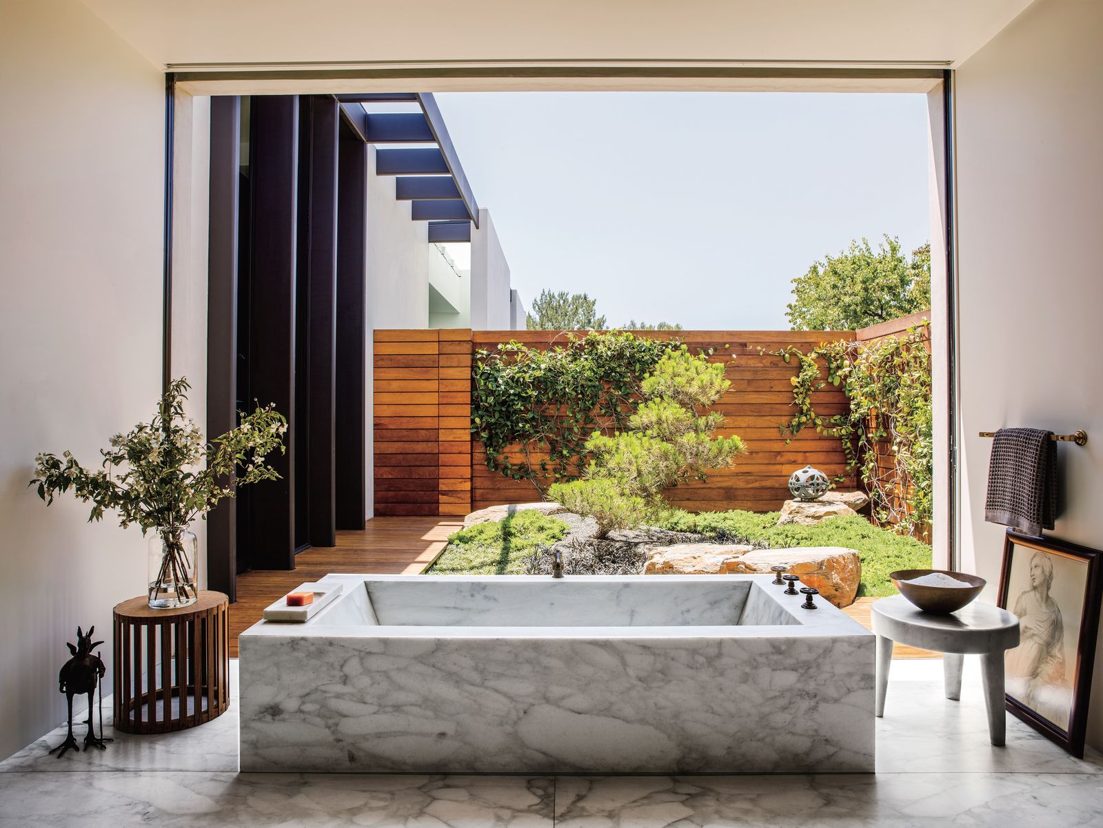 Image may contain Indoors Interior Design Tub Bathing Person Plant Bathtub Animal Bird Chicken Fowl and Poultry