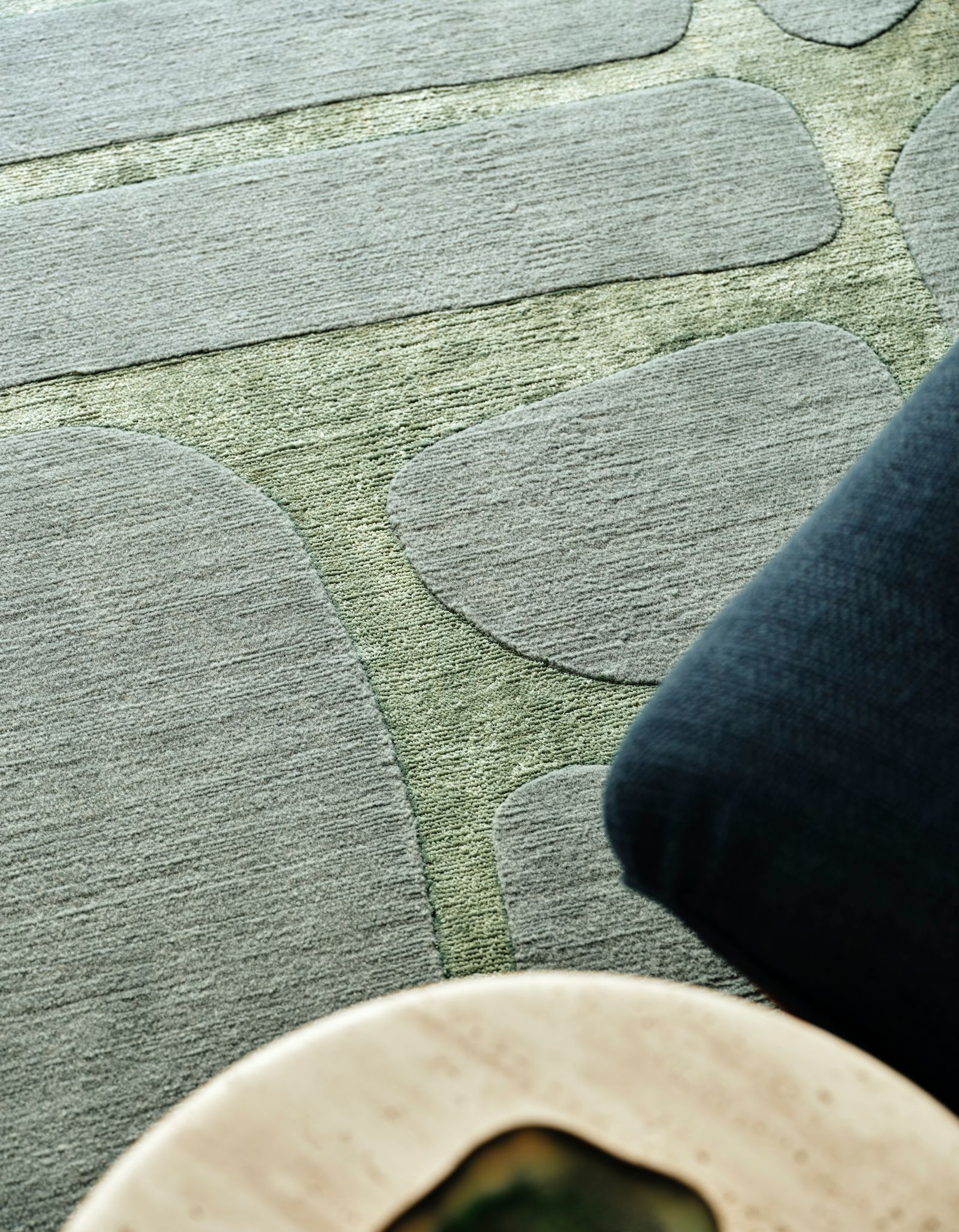 Image may contain Home Decor Rug Clothing Jeans and Pants