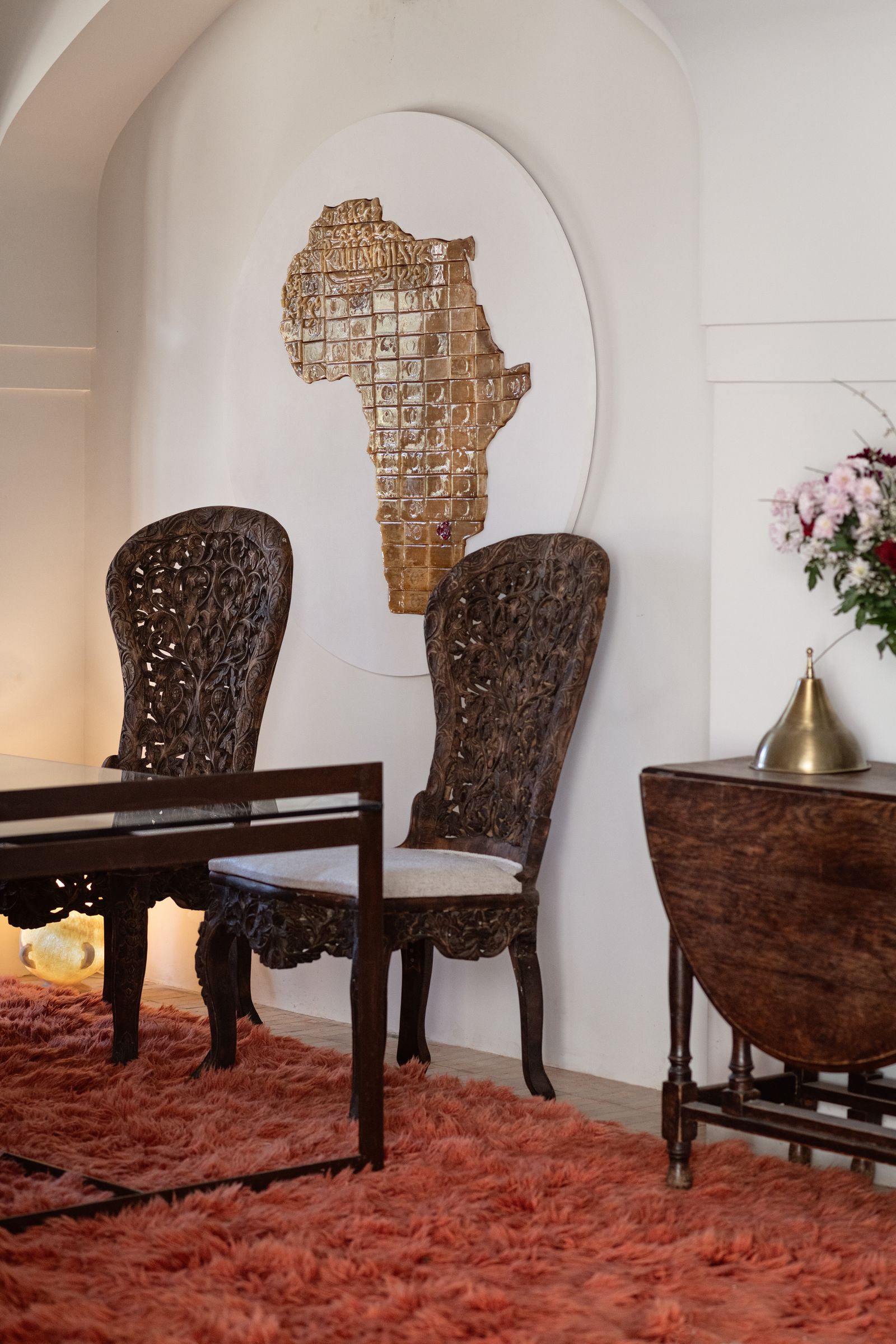 Image may contain Home Decor Rug Chair Furniture Table Indoors Interior Design Floor Flower Plant and Architecture
