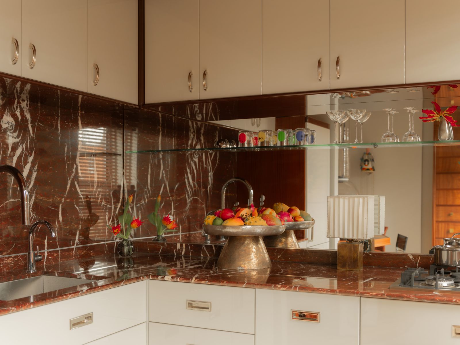 Mark Grattan's red marble kitchen countertops in Brooklyn. Image may contain Sink Sink Faucet Indoors Kitchen Interior...