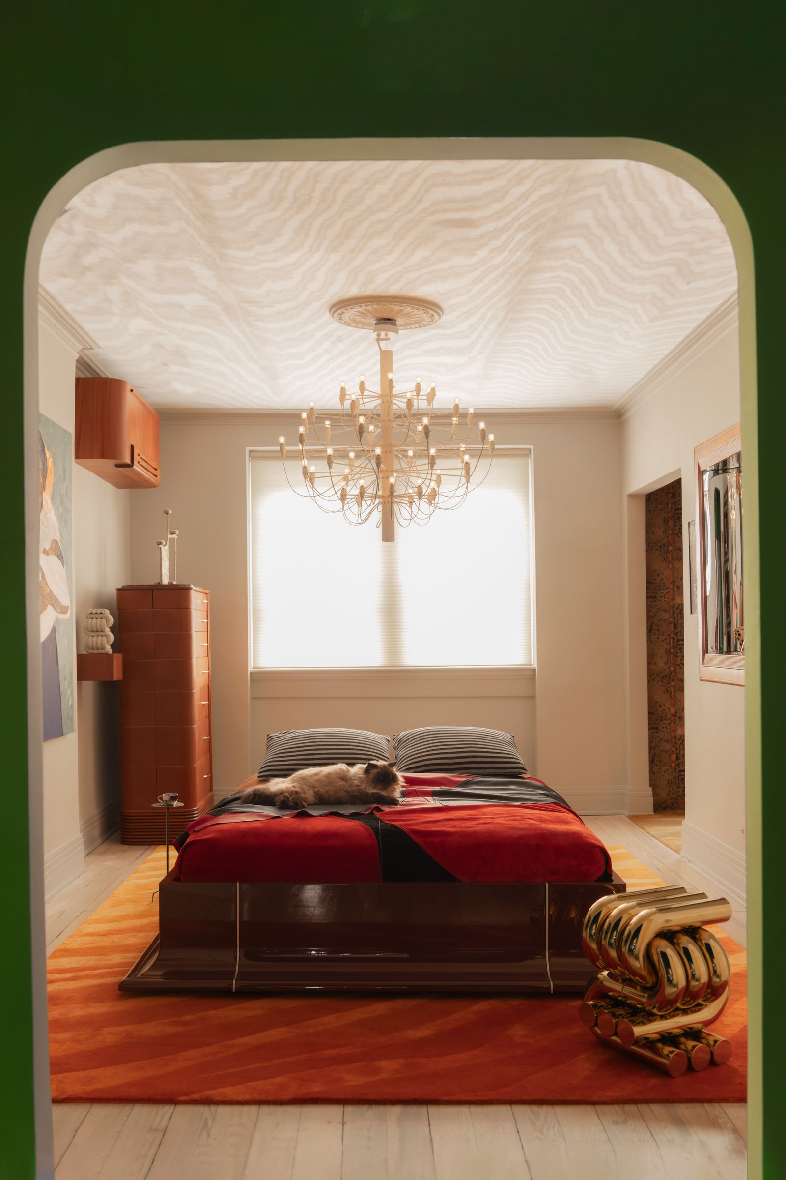 Image may contain Chandelier Lamp Indoors Interior Design Home Decor Bed Bedroom Furniture and Room