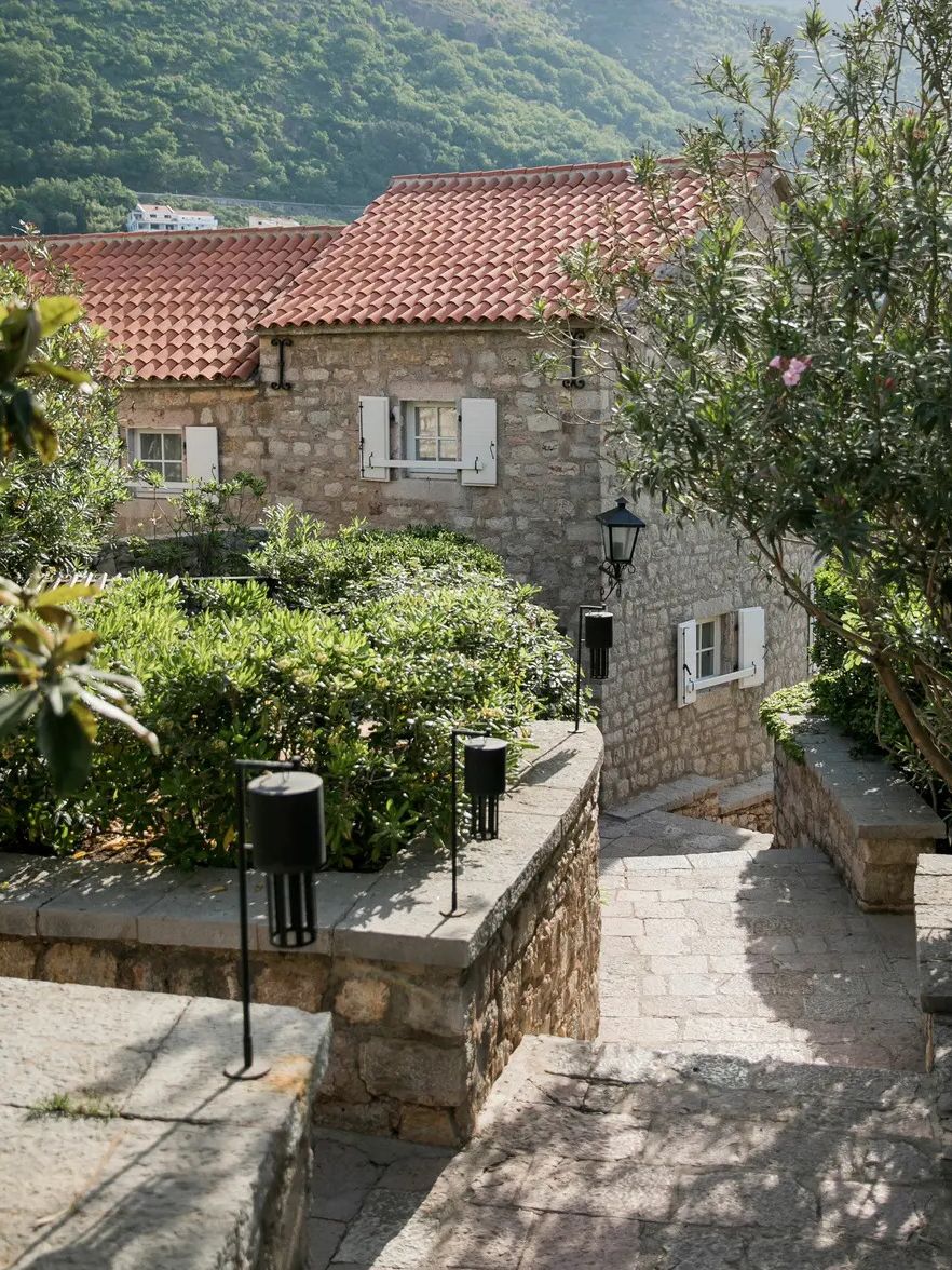 Image may contain Architecture Building Hotel Resort Outdoors Nature Countryside Lamp Rural Village and Housing