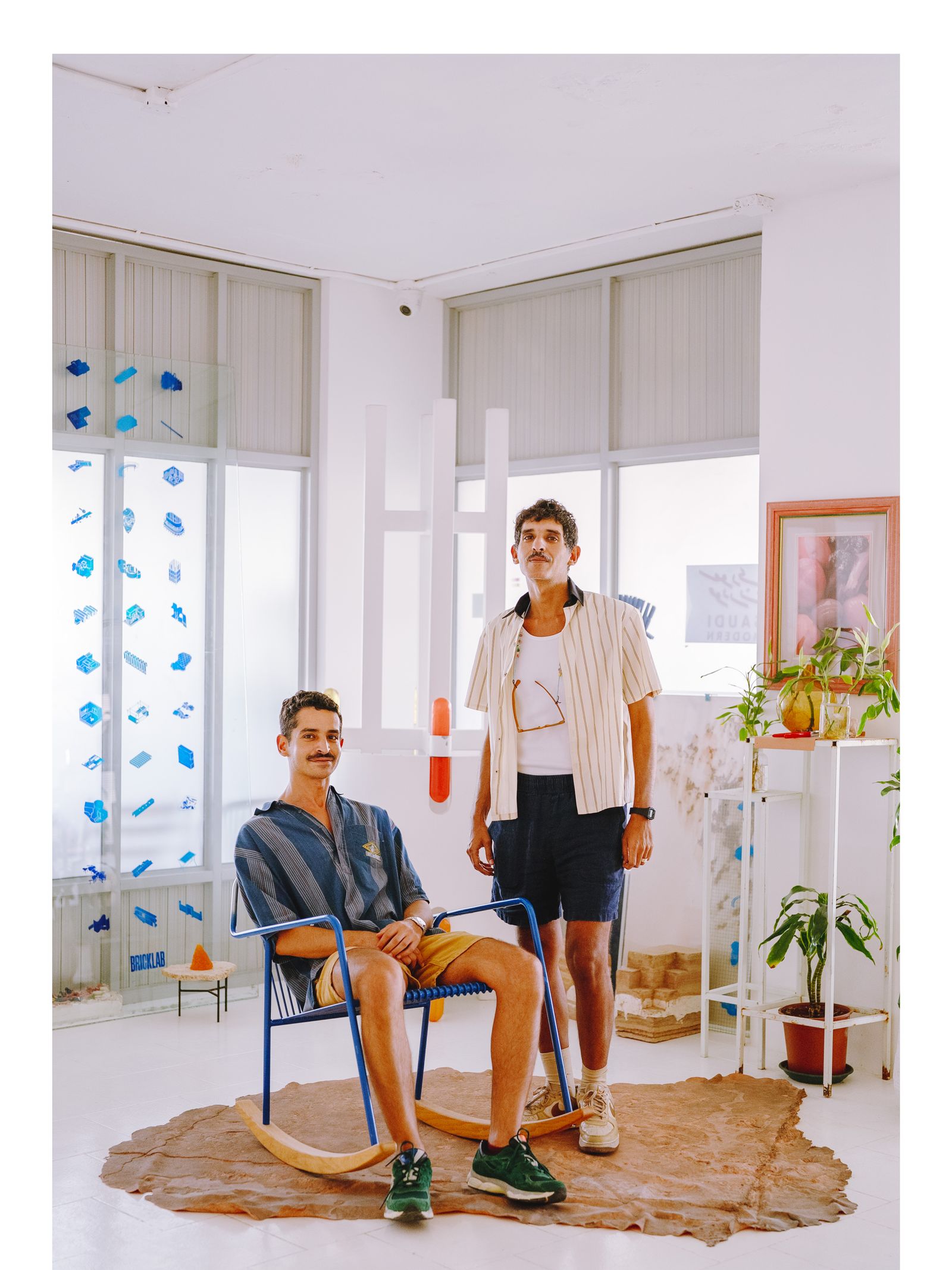 Image may contain Furniture Clothing Shorts Adult and Person