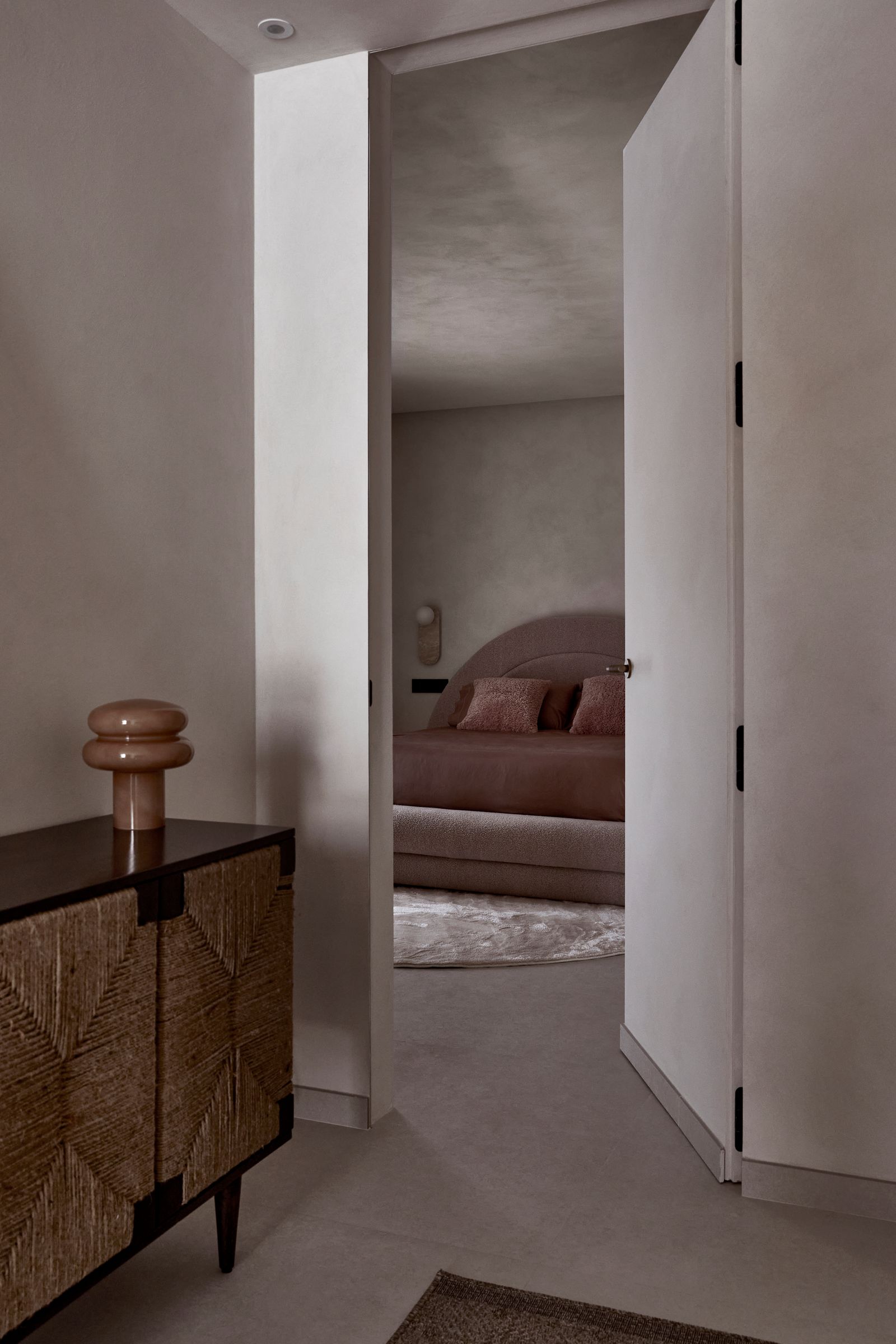 Image may contain Corner Door Indoors Interior Design Furniture Bed and Floor