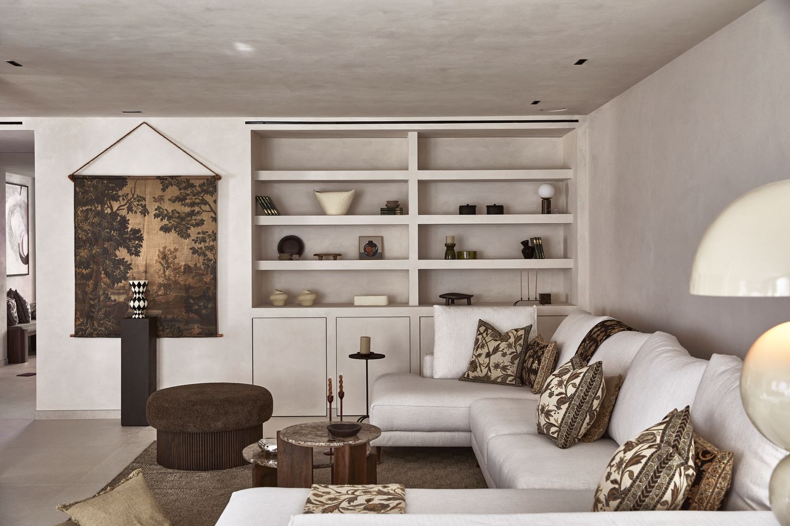 Image may contain Home Decor Furniture Indoors Interior Design Architecture Building Living Room Room and Candle