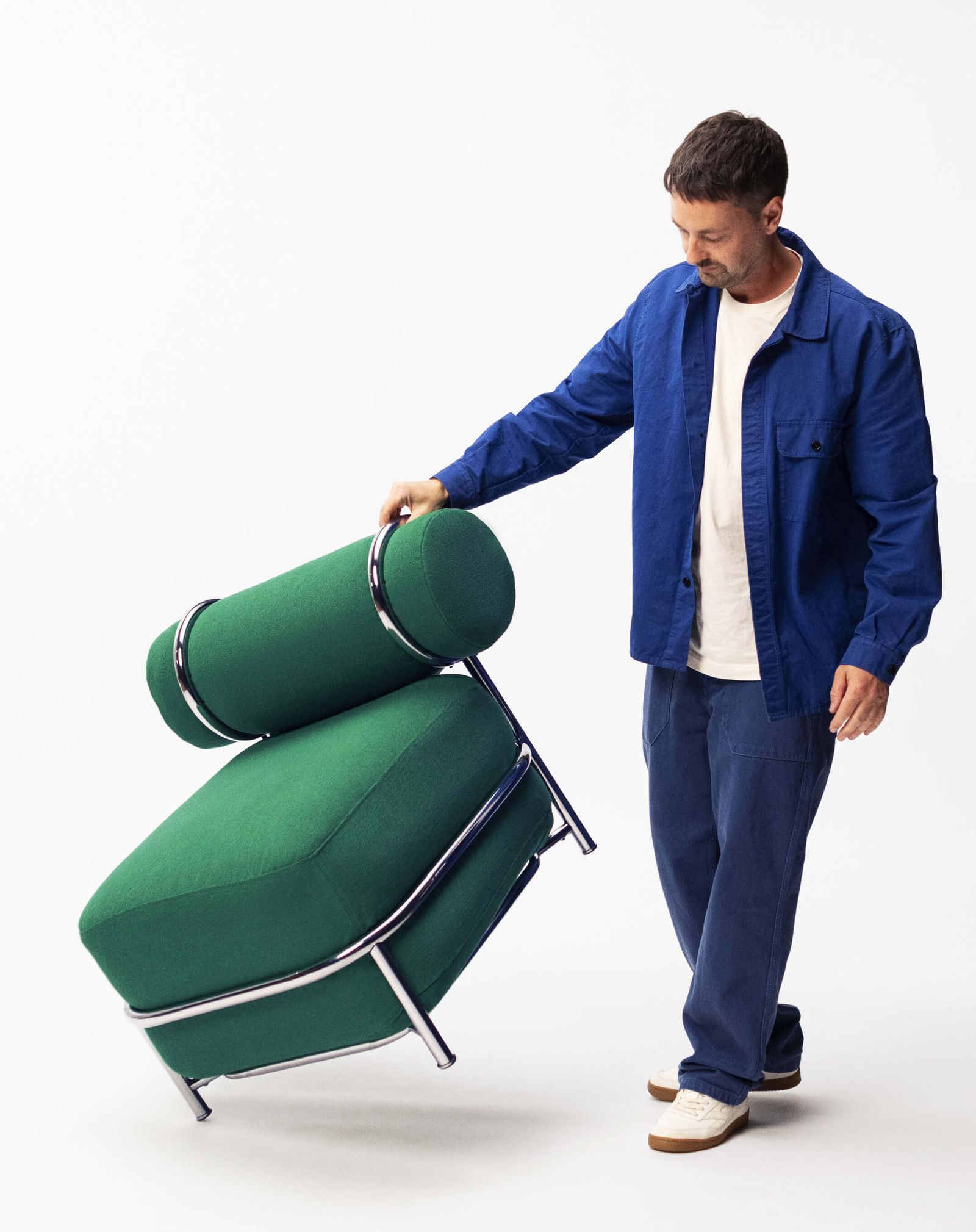 Image may contain Aaron Stainthorpe Adult Person Clothing Coat Baggage Blazer Jacket Chair and Furniture