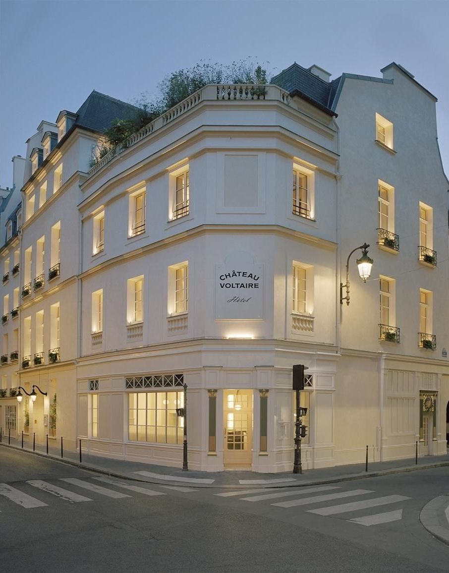 Image may contain Corner City Architecture Building Hotel Road Street Urban Condo Housing and Office Building
