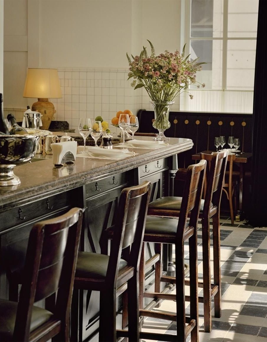 Image may contain Architecture Building Dining Room Dining Table Furniture Indoors Room Table and Interior Design