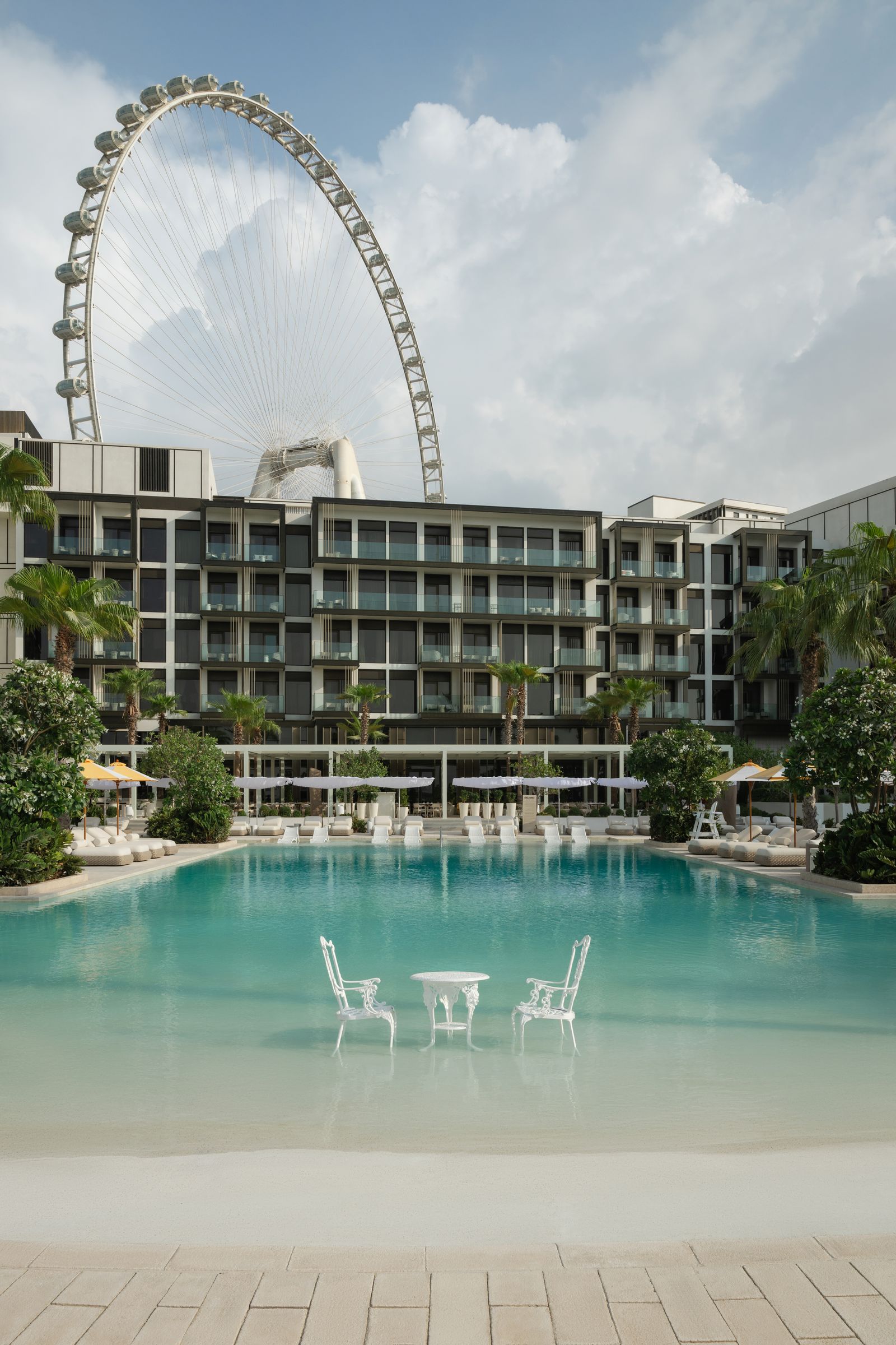 Image may contain Architecture Building Hotel Resort City Desk Furniture Table Chair Condo Housing and Urban