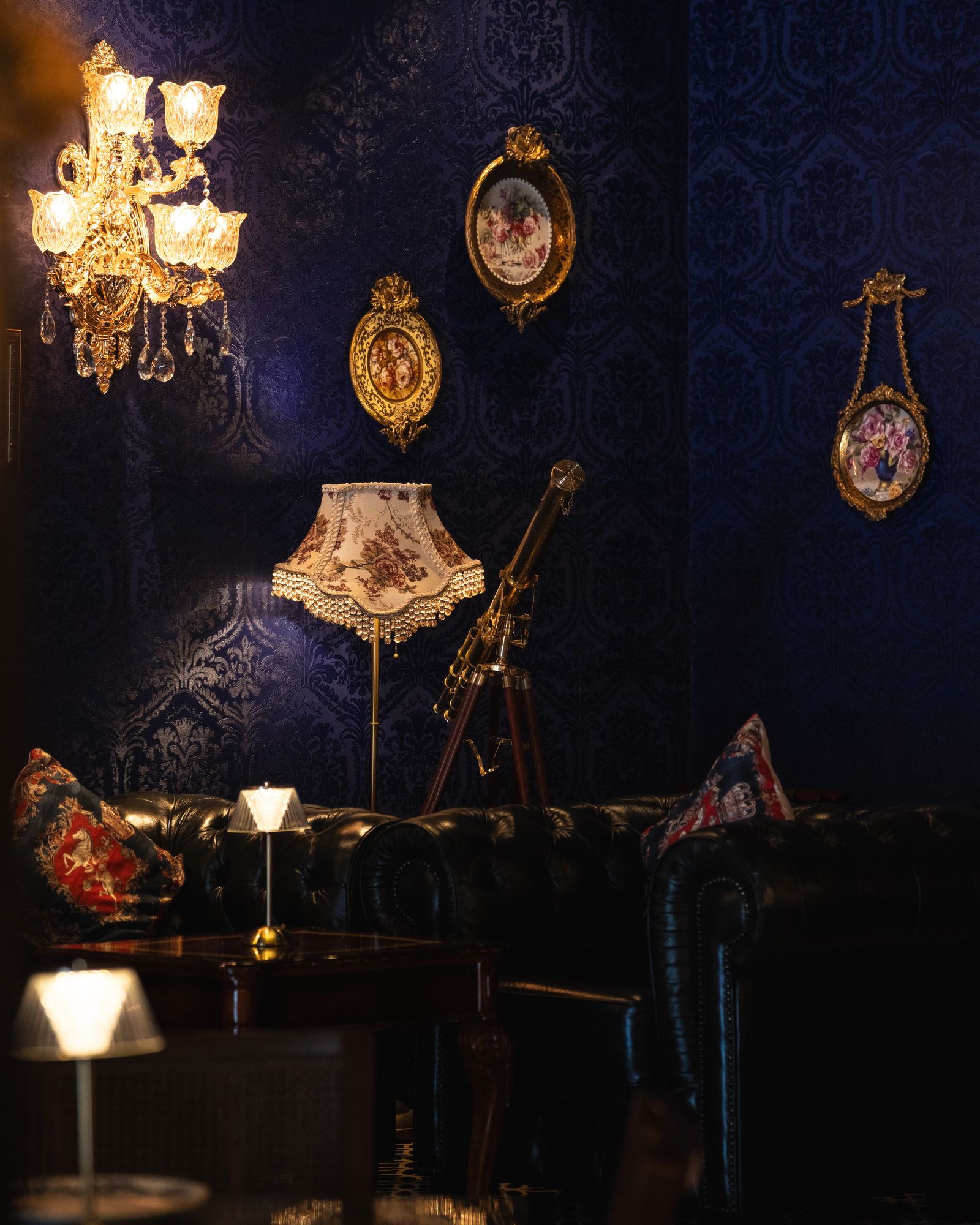 Image may contain Chandelier Lamp Couch Furniture Lighting Architecture Building Dining Room and Dining Table