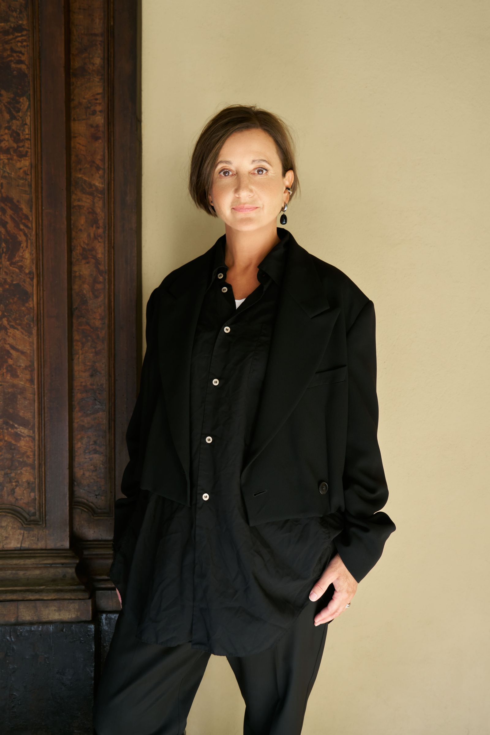 Image may contain Clothing Coat Face Head Person Photography Portrait Blazer Jacket and Adult