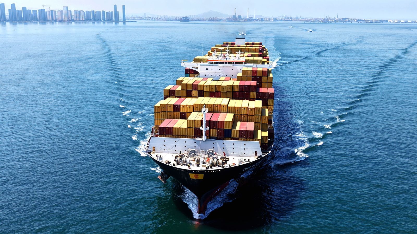 Image may contain Cargo Transportation Vehicle Boat Shipping Container Person and Cargo Container