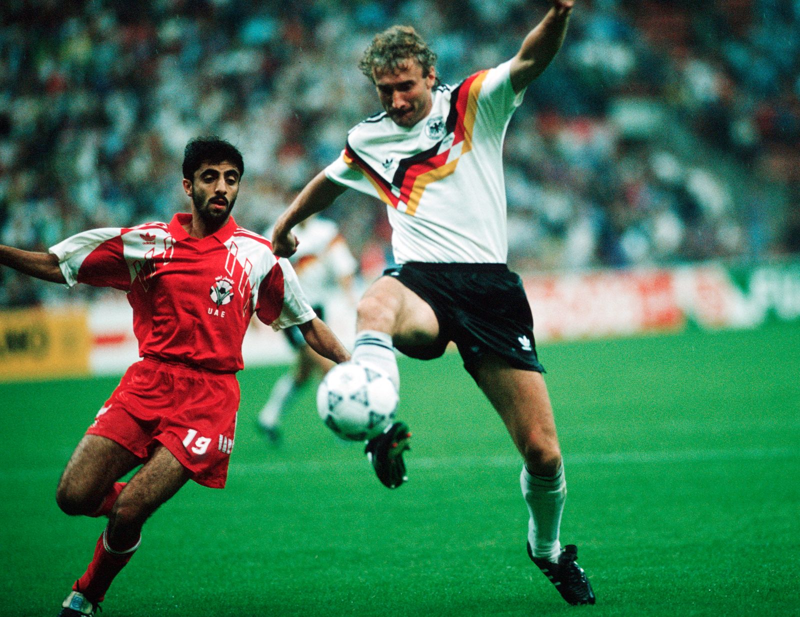 Image may contain Rudi Völler Zafer Biryol Ball Football Soccer Soccer Ball Sport Adult Person Clothing and Shorts