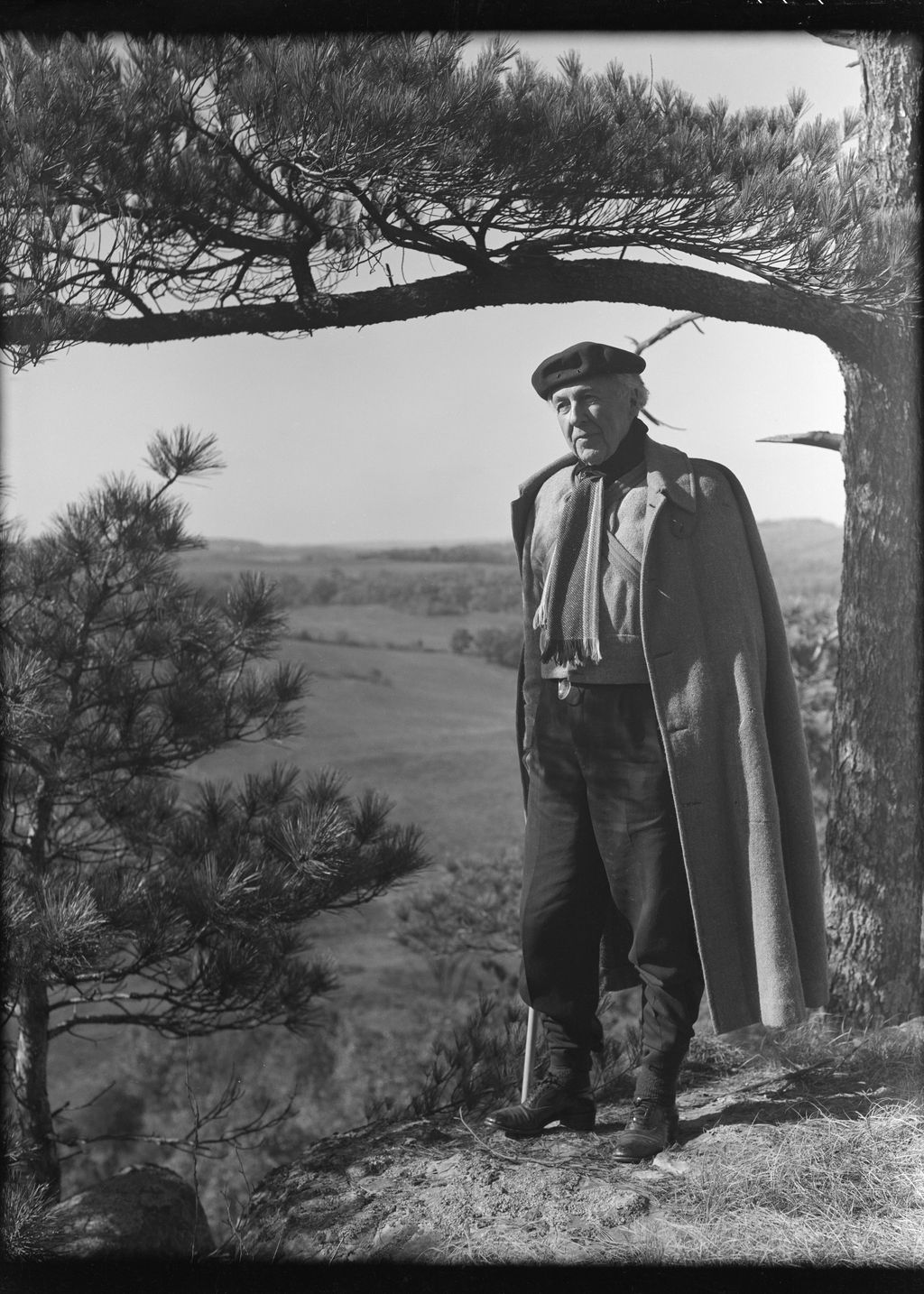 The architect Frank Lloyd Wright alone on the Taliesin East grounds