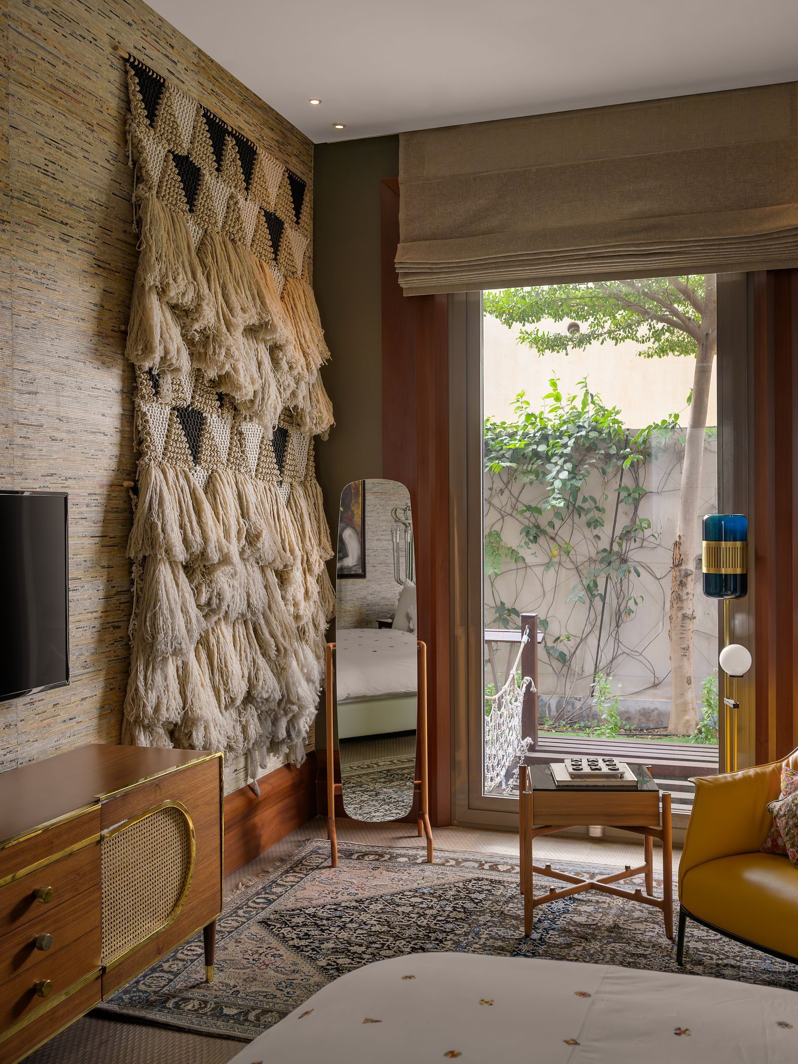 Image may contain Indoors Interior Design Home Decor Architecture Building Furniture Living Room Room Rug and Wood