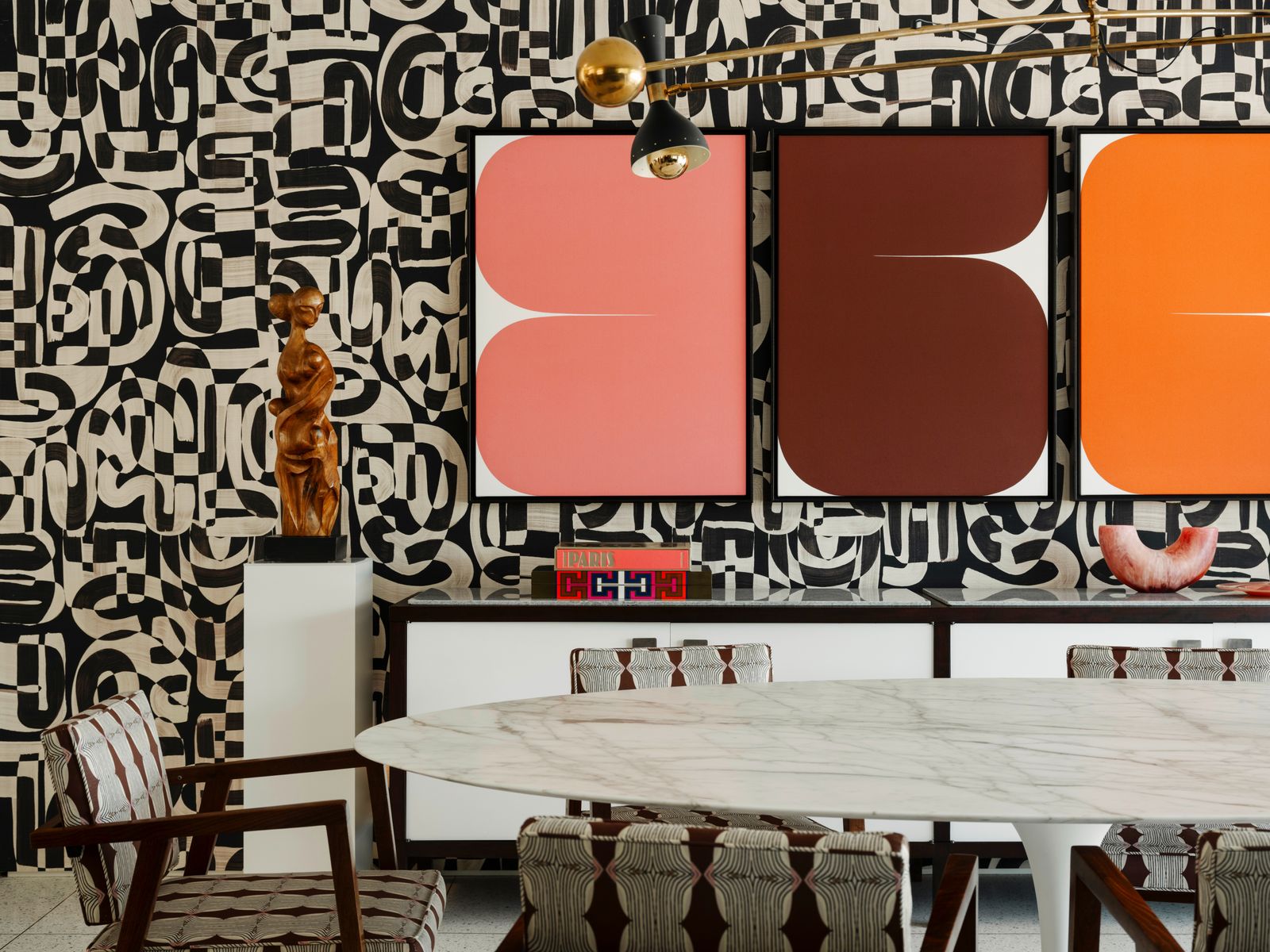Image may contain Indoors Interior Design Furniture Table Person Chair Restaurant Dining Table and Cafe