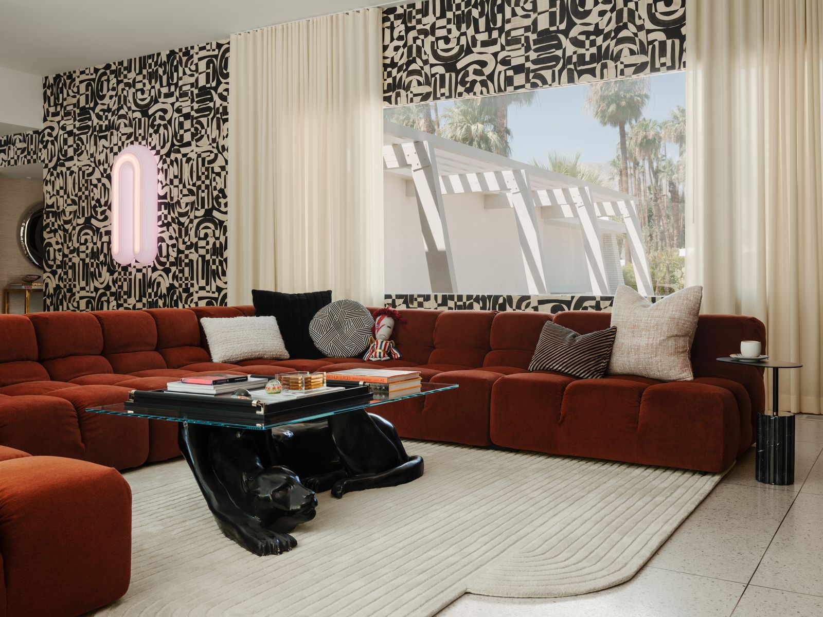 Image may contain Couch Furniture Home Decor Indoors Interior Design Table Architecture Building and Living Room