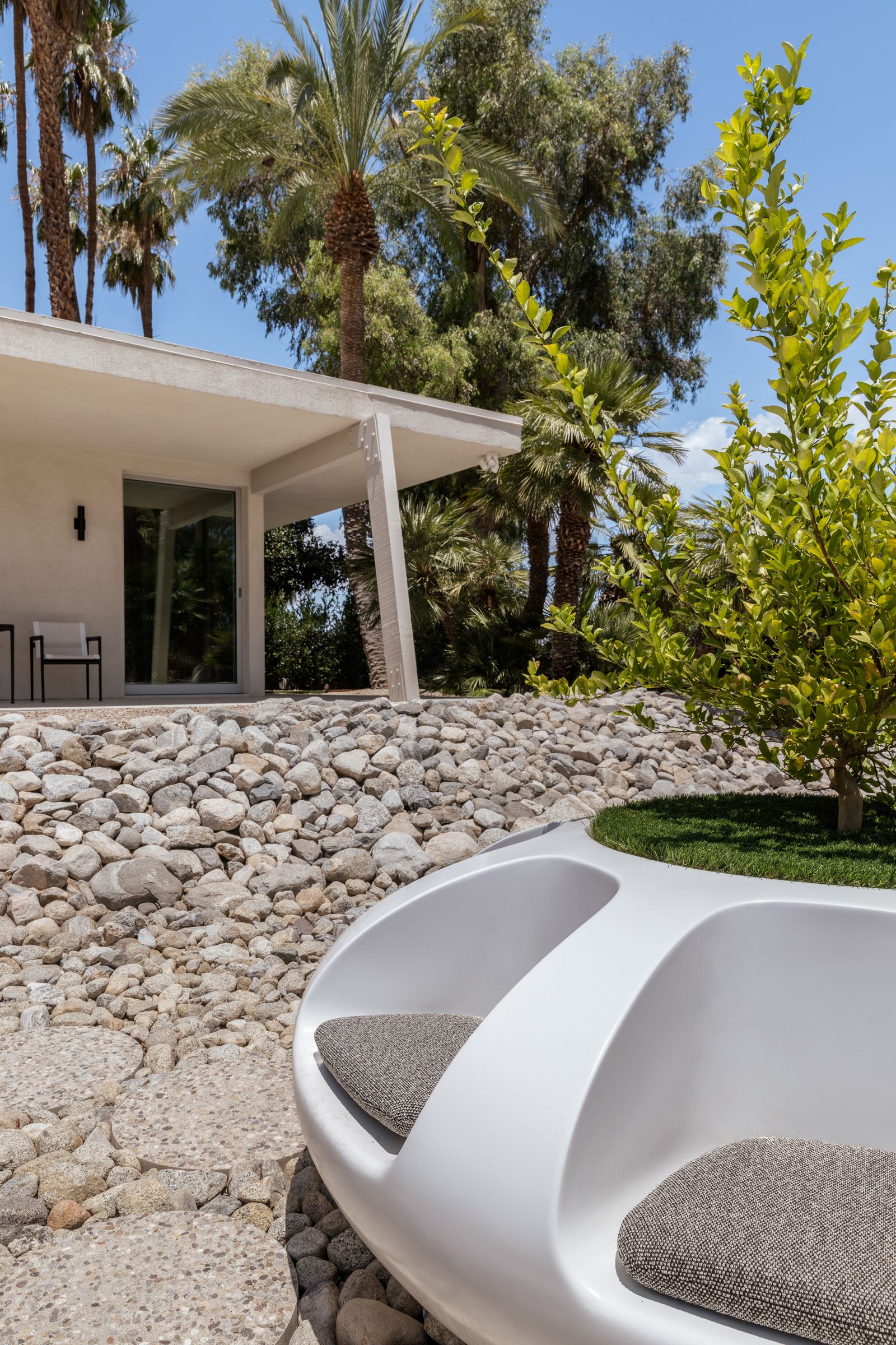 Image may contain Architecture Building House Housing Villa Backyard Nature Outdoors Yard Pebble and Indoors