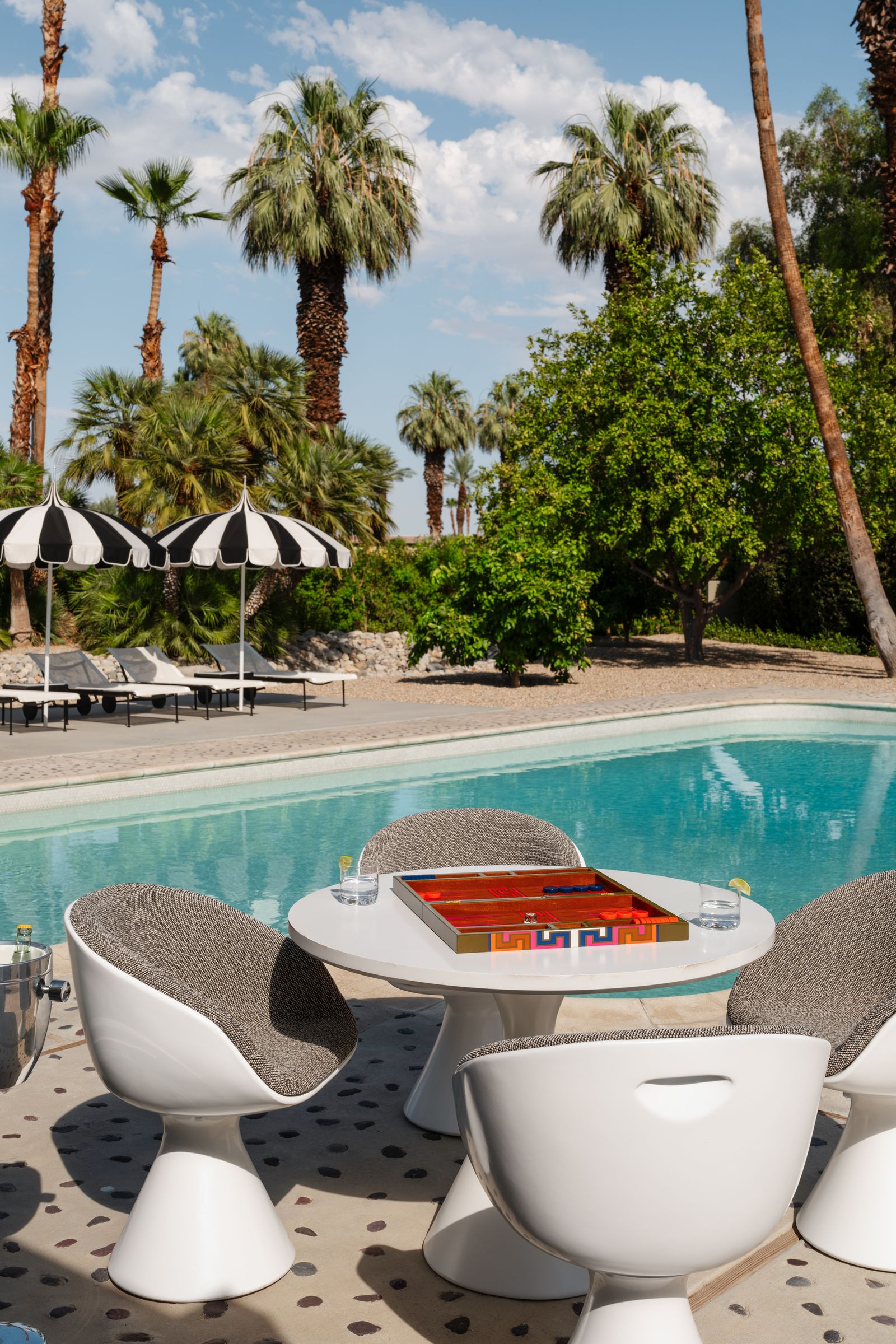 Image may contain Pool Water Swimming Pool Summer Chair Furniture Outdoors Architecture Building House and Housing