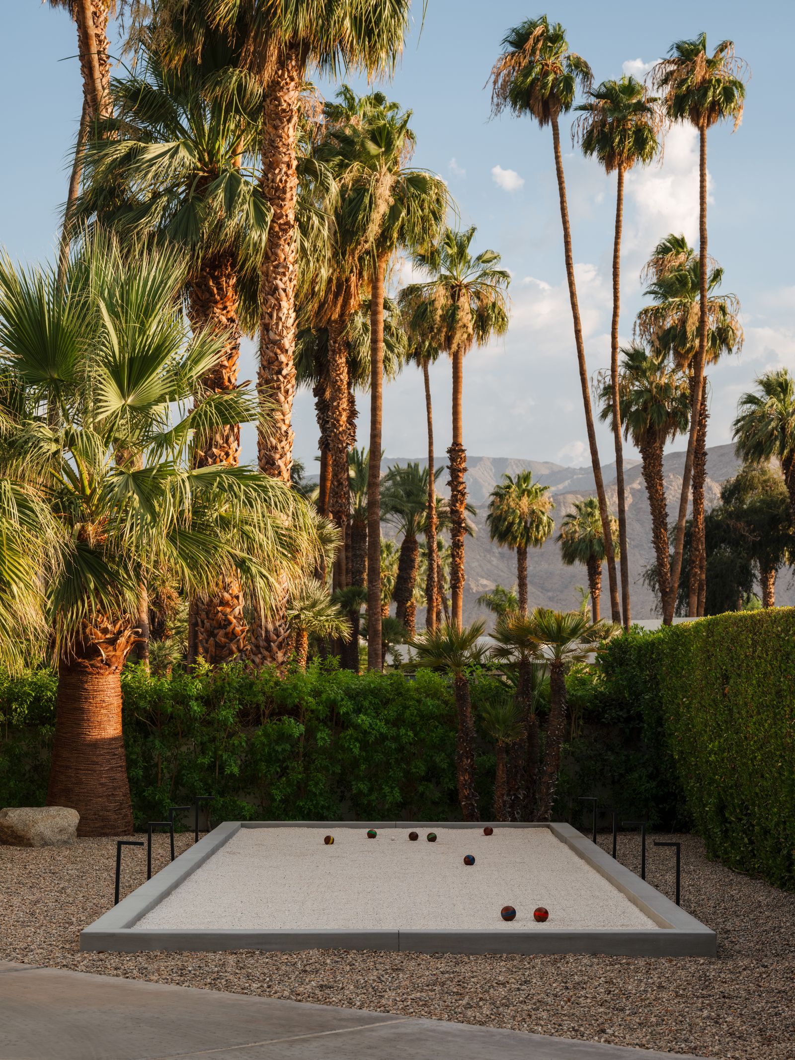 Image may contain Plant Tree Pool Water Architecture Building House Housing Villa Summer Palm Tree and Outdoors