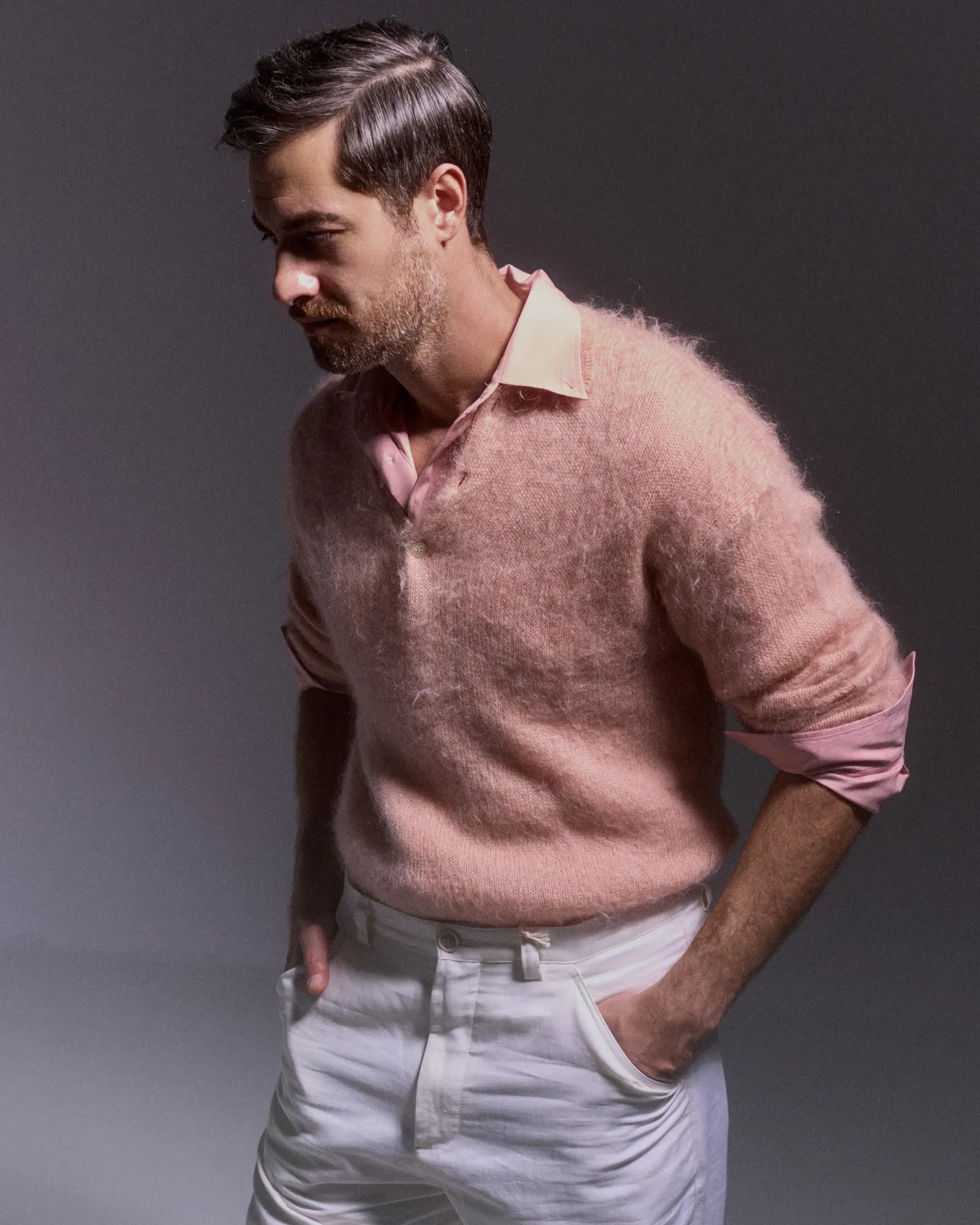 Image may contain Shahab Hosseini Adult Person Clothing Sleeve Face Head Knitwear and Sweater