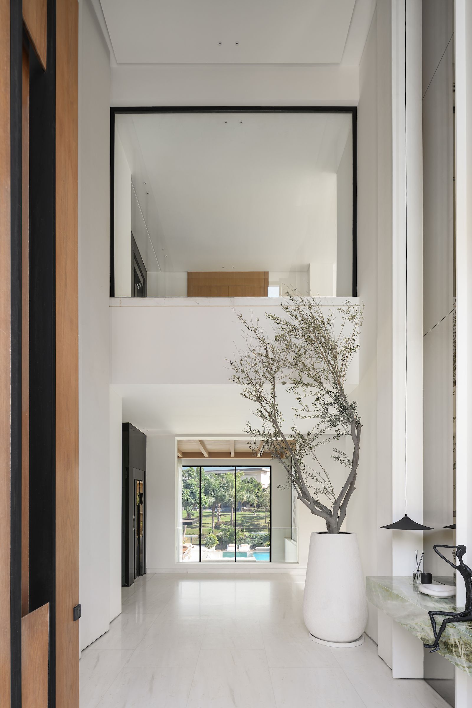 Image may contain Indoors Interior Design Floor Plant Architecture Building Foyer Plate and Cup