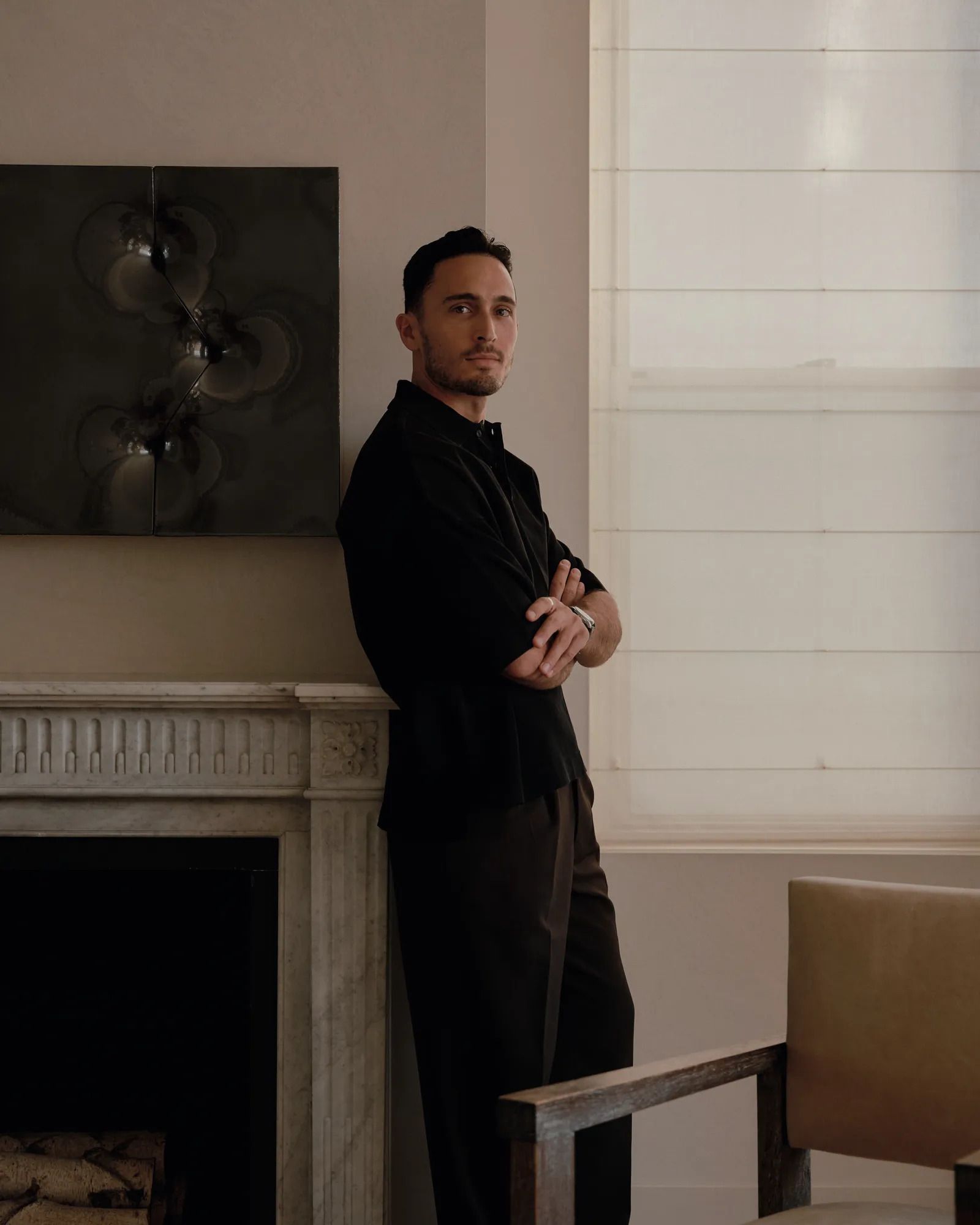 Image may contain John Daversa Adult Person Fireplace Indoors Face Head Photography Portrait and Standing
