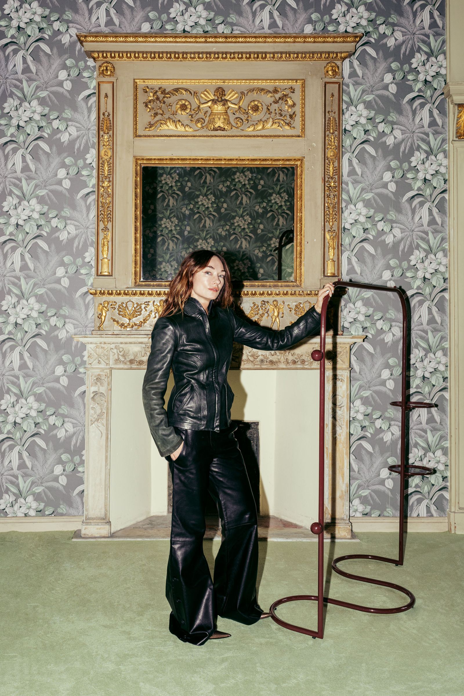 Image may contain Kelly Wearstler Performer Person Solo Performance Clothing Coat Jacket Adult and Electrical Device