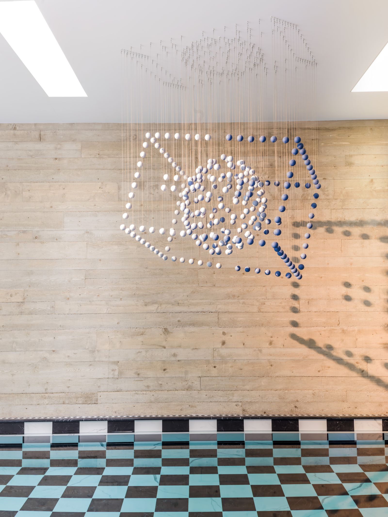 Image may contain Indoors Interior Design Floor Chandelier Lamp Flooring Architecture Building and Foyer
