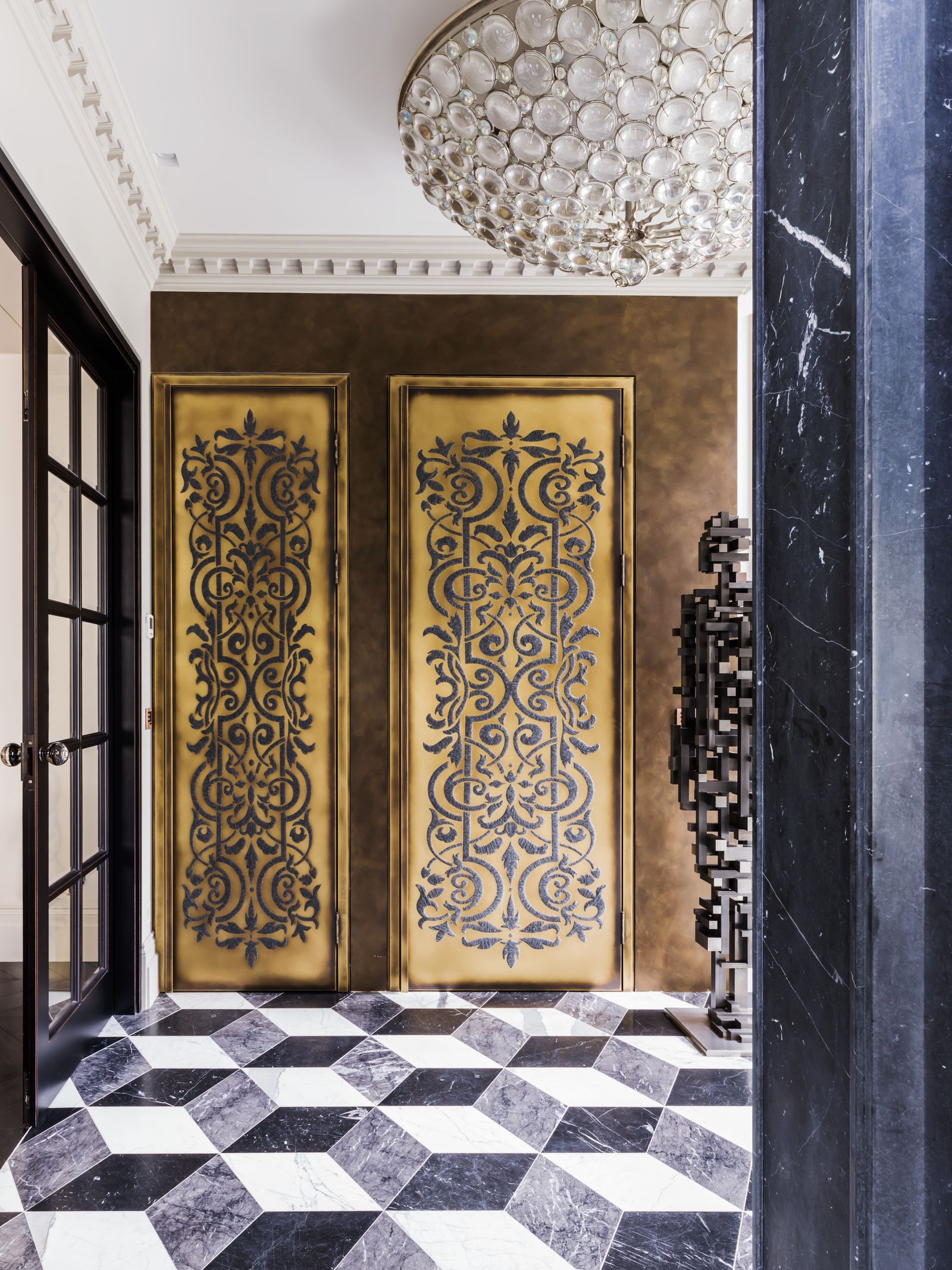 Image may contain Floor Indoors Door Chandelier Lamp Interior Design Architecture Building and Foyer