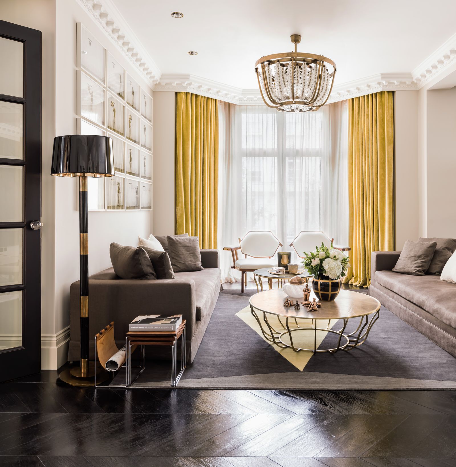 Image may contain Home Decor Coffee Table Furniture Table Architecture Building Indoors Living Room Room and Lamp